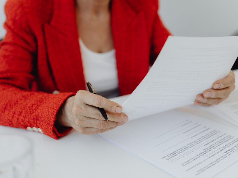 woman reading important divorce papers to file for divorce in Allegheny county